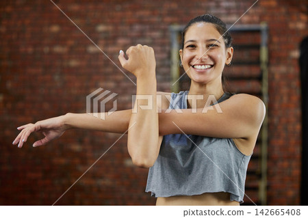 Woman, portrait and stretching with exercise, smile and workout start for health and wellness. Athlete, cardio and warmup for muscle performance, happiness and training with fitness routine in gym Woman, portrait and stretching with exercise, smile and workout start for health and wellness. Athlete, cardio and warmup for muscle performance, happiness and training with fitness routine in gym 142665408