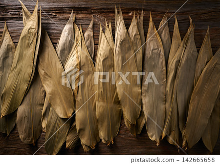 Dried Bamboo leaves in brown for Zongzi recipe Dried Bamboo leaves in brown for Zongzi recipe 142665658