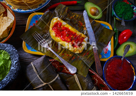 Tamale Mexican recipe with banana leaves Tamale Mexican recipe with banana leaves 142665659