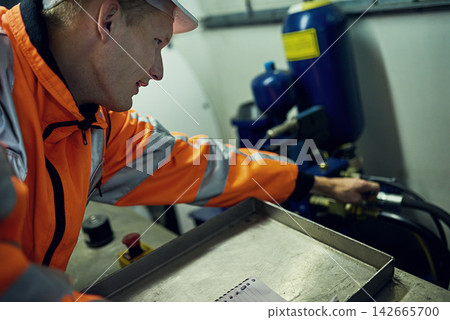 Generator, machine and man in electricity maintenance, engineering and industrial grid inspection. Renewable energy, production and technician checking electrical power system for quality assurance Generator, machine and man in electricity maintenance, engineering and industrial grid inspection. Renewable energy, production and technician checking electrical power system for quality assurance 142665700