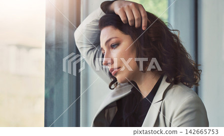 Business, window and sad woman with burnout or stress with kpi review mistake or depression. Person, employee or professional with mental health, emotion or fail with debt, worry or negative feedback Business, window and sad woman with burnout or stress with kpi review mistake or depression. Person, employee or professional with mental health, emotion or fail with debt, worry or negative feedback 142665753