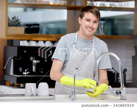 Cleaning, washing and dishes for man in home kitchen, portrait and gloves for hand. Dirty, smile and hygiene with soap for bacteria prevention, germs and disinfect crockery for ocd male person Cleaning, washing and dishes for man in home kitchen, portrait and gloves for hand. Dirty, smile and hygiene with soap for bacteria prevention, germs and disinfect crockery for ocd male person 142665919
