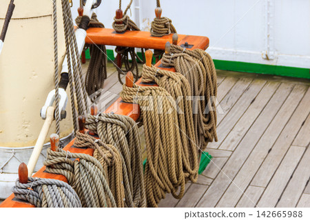 Nautical ropes on a deck of a large ship Nautical ropes on a deck of a large ship 142665988