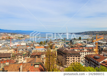 Panoramic view of city of Geneva, Lake Geneva and Jet d'Eau fountain in Switzerland. View from the bell tower of Saint Pierre Cathedral Panoramic view of city of Geneva, Lake Geneva and Jet d'Eau fountain in Switzerland. View from the bell tower of Saint Pierre Cathedral 142666031
