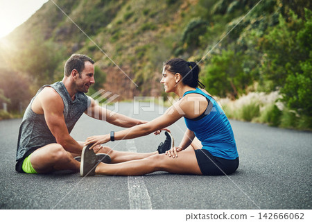 Fitness, health and couple for stretch before running for marathon preparation outdoor on street. Sports, man and woman with warm up for cardio workout, exercise and training with personal trainer Fitness, health and couple for stretch before running for marathon preparation outdoor on street. Sports, man and woman with warm up for cardio workout, exercise and training with personal trainer 142666062