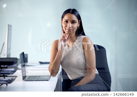 Smile, business woman and portrait by laptop for communication, planning and development for corporate career. Professional, manager and lawyer in office or workspace with technology and confidence Smile, business woman and portrait by laptop for communication, planning and development for corporate career. Professional, manager and lawyer in office or workspace with technology and confidence 142666149