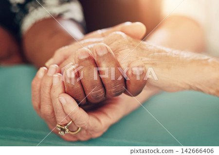 Holding hands, support and senior people with empathy, love and care at a retirement home with help. Solidarity, loyalty and kindness with safe and trust gesture of couple of friends together Holding hands, support and senior people with empathy, love and care at a retirement home with help. Solidarity, loyalty and kindness with safe and trust gesture of couple of friends together 142666406