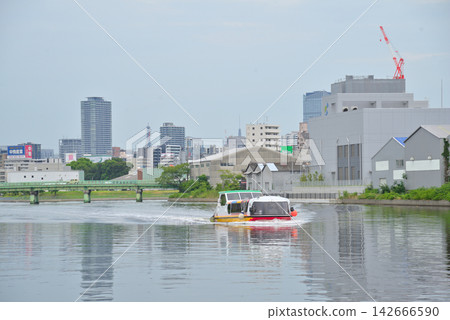 Aichi Prefecture: Nagoya cityscape - water bus traveling along the Nakagawa Canal Aichi Prefecture: Nagoya cityscape - water bus traveling along the Nakagawa Canal 142666590