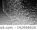 Platinum ripples and sandy textures melt into the pitch-black night. 142666626