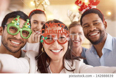 Christmas selfie, portrait and happy team in office for diversity or celebration of business people together. Face, xmas picture and group of friends at party, holiday or consultant at festive event Christmas selfie, portrait and happy team in office for diversity or celebration of business people together. Face, xmas picture and group of friends at party, holiday or consultant at festive event 142666639