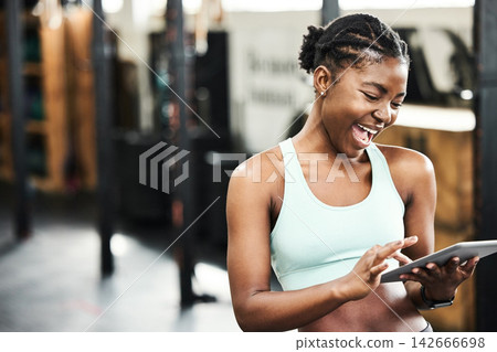 Gym, healthy and black girl with tablet, happy and videos for fitness, practice and sports online. Club, app and technology for person, internet and wellness with sportswear, training and weekend Gym, healthy and black girl with tablet, happy and videos for fitness, practice and sports online. Club, app and technology for person, internet and wellness with sportswear, training and weekend 142666698