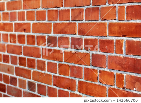 Building, city and closeup of red, brick wall for texture, background and pattern of exterior structure. Architecture design, construction and surface of material, concrete and cement for decoration Building, city and closeup of red, brick wall for texture, background and pattern of exterior structure. Architecture design, construction and surface of material, concrete and cement for decoration 142666700