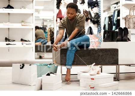 Pain, feet and shoe shopping for black woman, retail and boutique or designer products. Customer, sale and try for wardrobe and sore heels, mall and fashion for new closet purchase and footwear store Pain, feet and shoe shopping for black woman, retail and boutique or designer products. Customer, sale and try for wardrobe and sore heels, mall and fashion for new closet purchase and footwear store 142666866