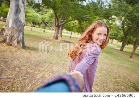 POV, holding hands and happy couple with woman portrait and smile in park with love on holiday. Walking, care and student in nature and together on vacation outdoor with travel and date with support 142666903