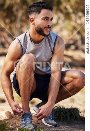 Man, runner and tying laces in nature, prepare and ready for exercise or outdoor fitness. Male person, athlete and sneakers for jog or marathon training, gear and footwear for sports or wellness Man, runner and tying laces in nature, prepare and ready for exercise or outdoor fitness. Male person, athlete and sneakers for jog or marathon training, gear and footwear for sports or wellness 142666905