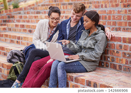 Happy, group of students and laptop, sitting or bonding with laptop outside on campus stairs. College people, smile and computer with teamwork and support for study help with education at university Happy, group of students and laptop, sitting or bonding with laptop outside on campus stairs. College people, smile and computer with teamwork and support for study help with education at university 142666906