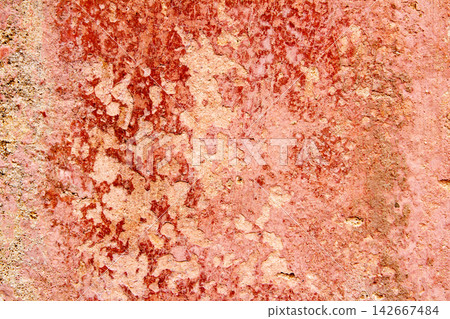 Aged weathered painted wall in red grunge tones 142667484