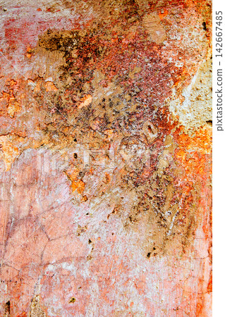 Aged weathered painted wall in red grunge tones Aged weathered painted wall in red grunge tones 142667485