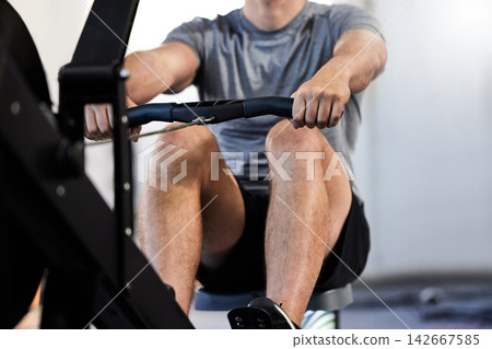 Athletic man, fitness and health in gym on rowing machine, activewear and equipment for muscle, wellness and bodybuilding. Male person, active and exercise in workout for training, sports and cardio Athletic man, fitness and health in gym on rowing machine, activewear and equipment for muscle, wellness and bodybuilding. Male person, active and exercise in workout for training, sports and cardio 142667585