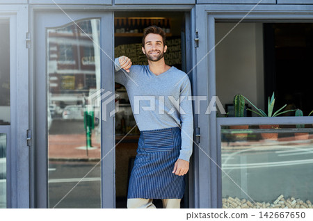 Happy, small business and portrait of man at coffee shop for service industry, welcome or smiling. Confidence, entrepreneur and male barista with apron at cafe entrance, doorway or front door Happy, small business and portrait of man at coffee shop for service industry, welcome or smiling. Confidence, entrepreneur and male barista with apron at cafe entrance, doorway or front door 142667650