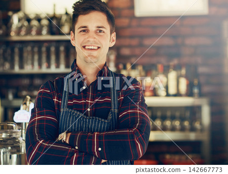 Man, portrait and smile with small business, restaurant and confidence startup for pizzeria. Chef, entrepreneur and arms crossed for bistro, food and service industry owner in New York cafe in apron Man, portrait and smile with small business, restaurant and confidence startup for pizzeria. Chef, entrepreneur and arms crossed for bistro, food and service industry owner in New York cafe in apron 142667773