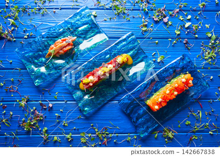 Salmon and Tuna Tartare with Anchovies Salmon and Tuna Tartare with Anchovies 142667838