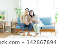 Middle couples relaxing in the living room Middle couples relaxing in the living room 142667894