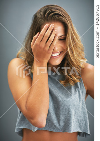 Fashion, youth and woman in studio laughing with positive attitude, wellness and fun clothes in USA. Smile, relax and happy gen z girl in cool, trendy and casual style and isolated on grey background Fashion, youth and woman in studio laughing with positive attitude, wellness and fun clothes in USA. Smile, relax and happy gen z girl in cool, trendy and casual style and isolated on grey background 142667915