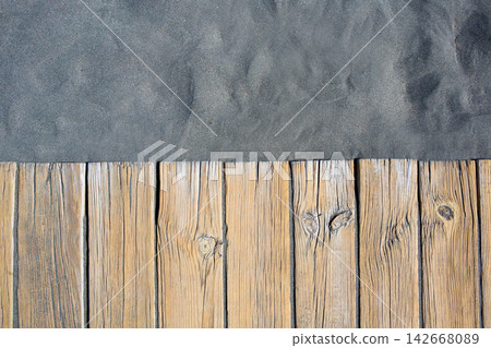 Black beach sand and wooden floor Black beach sand and wooden floor 142668089