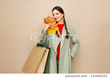 Autumn portrait of beautiful young woman 142668203