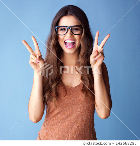 Woman, peace sign and glasses in studio portrait with vote, excited and fashion by background. Girl, person and student with style, clothes or smile with icon, symbol or emoji for winning at college Woman, peace sign and glasses in studio portrait with vote, excited and fashion by background. Girl, person and student with style, clothes or smile with icon, symbol or emoji for winning at college 142668285
