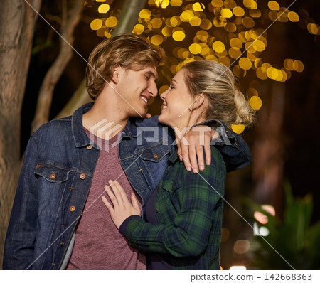 Couple, happy and kiss in outdoor, night and lights for love, city and romance. Bonding, smile and people in date, relationship and walking while together, affection and spark for commitment Couple, happy and kiss in outdoor, night and lights for love, city and romance. Bonding, smile and people in date, relationship and walking while together, affection and spark for commitment 142668363
