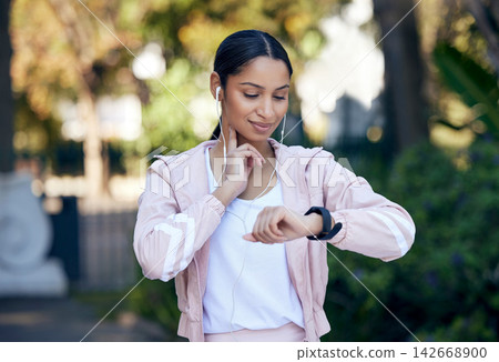 Fitness, woman and pulse rate outdoor after running, workout and exercise with smile as routine. Runner, female person and smart watch for checking endurance, wellness and mental health in park Fitness, woman and pulse rate outdoor after running, workout and exercise with smile as routine. Runner, female person and smart watch for checking endurance, wellness and mental health in park 142668900