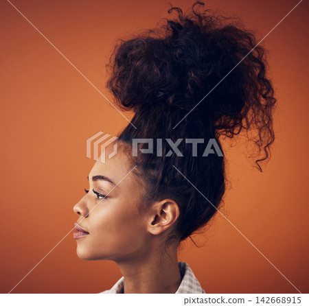 Thinking, beauty and woman in studio for hair, cosmetics and style solution against orange background. Profile, planning and model with idea for natural haircare, mockup and steps for diy messy bun Thinking, beauty and woman in studio for hair, cosmetics and style solution against orange background. Profile, planning and model with idea for natural haircare, mockup and steps for diy messy bun 142668915