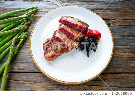 Grilled beef tenderloin with piquillo peppers Grilled beef tenderloin with piquillo peppers 142668990