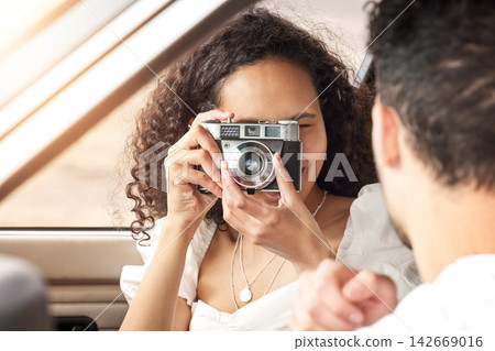 Couple, camera and photography in car with travel for road trip, happy memory and holiday adventure. People, photographer and picture in vehicle with journey, summer vacation and fun weekend drive Couple, camera and photography in car with travel for road trip, happy memory and holiday adventure. People, photographer and picture in vehicle with journey, summer vacation and fun weekend drive 142669016