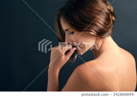 Woman, beauty and bare in studio for skincare, dermatology or cosmetic on dark background. Young person, topless and behind for natural, smooth aesthetic or body care for confident on mockup Woman, beauty and bare in studio for skincare, dermatology or cosmetic on dark background. Young person, topless and behind for natural, smooth aesthetic or body care for confident on mockup 142669044