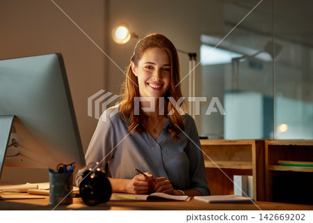 Woman, employee and smile in office with computer on work break for overtime or deadline at night. Female person, portrait and worker with notepad as administrator for schedule, agenda and notes 142669202