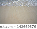 Caribbean white sand shore wave foam 142669376