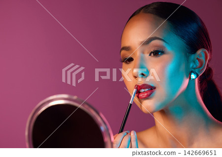 Woman, makeup artist and lipstick in mirror with neon lights in studio for beauty and art deco. Female person, cosmetics and pride for futuristic, design and creative by pink backdrop with glow Woman, makeup artist and lipstick in mirror with neon lights in studio for beauty and art deco. Female person, cosmetics and pride for futuristic, design and creative by pink backdrop with glow 142669651