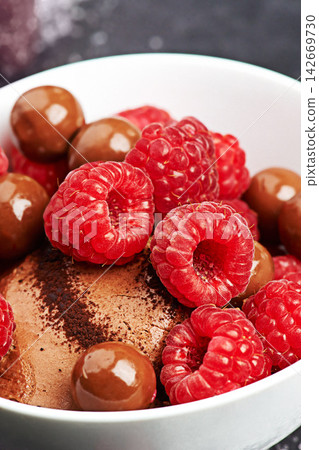 Desert, fruit and chocolate in bakery for eating, health and wellness isolated in kitchen for enjoyment. Sweet treat, pastry filling and raspberry with cocoa for eating, sugar and vitamin intake. Desert, fruit and chocolate in bakery for eating, health and wellness isolated in kitchen for enjoyment. Sweet treat, pastry filling and raspberry with cocoa for eating, sugar and vitamin intake. 142669730