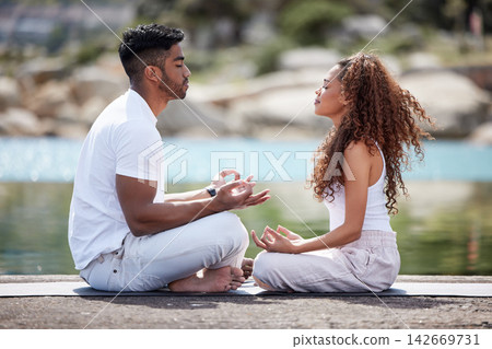 Beach, couple and lotus pose for meditation, mindfulness and holistic wellness outdoor. People, man and woman with zen for bonding in California to relax, peace and mental health in relationship Beach, couple and lotus pose for meditation, mindfulness and holistic wellness outdoor. People, man and woman with zen for bonding in California to relax, peace and mental health in relationship 142669731