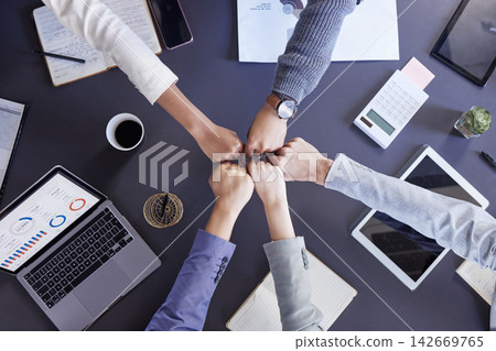 Business people, fist bump and above in office for meeting with planning, synergy and teamwork. Hands, collaboration and trust in financial company with analytics for partnership with technology. Business people, fist bump and above in office for meeting with planning, synergy and teamwork. Hands, collaboration and trust in financial company with analytics for partnership with technology. 142669765