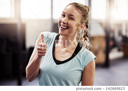 Woman, portrait and thumbs up for gym exercise or workout approval, good job or support. Female person, face and hand gesture for fitness routine or training results with weight loss, winner or proud Woman, portrait and thumbs up for gym exercise or workout approval, good job or support. Female person, face and hand gesture for fitness routine or training results with weight loss, winner or proud 142669823