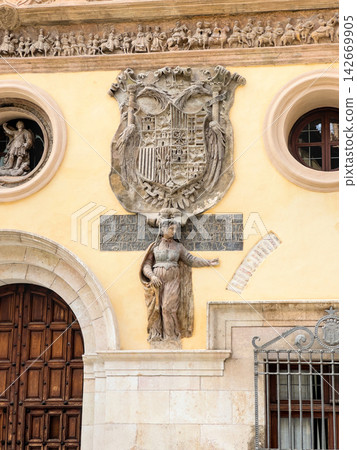 Imperial coat of arms and allegorical statue on the Renaissance town hall facade in Tarazona Imperial coat of arms and allegorical statue on the Renaissance town hall facade in Tarazona 142669905