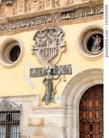 Coat of arms of Aragon and allegory of Justice on the town hall facade in Tarazona, Spain Coat of arms of Aragon and allegory of Justice on the town hall facade in Tarazona, Spain 142669906