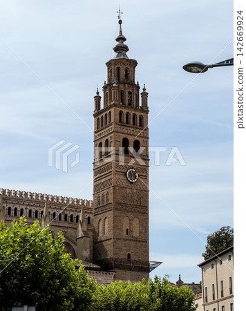 Mudejar bell tower of the cathedral of Tarazona, Aragon, Spain, against a clear sky Mudejar bell tower of the cathedral of Tarazona, Aragon, Spain, against a clear sky 142669924