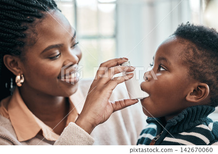Black family, mother or inhaler for child with asthma in home living room with chest pain or emergency. Anxiety, oxygen or mom with baby, boy and kid with panic attack, allergy and breathing pump Black family, mother or inhaler for child with asthma in home living room with chest pain or emergency. Anxiety, oxygen or mom with baby, boy and kid with panic attack, allergy and breathing pump 142670060