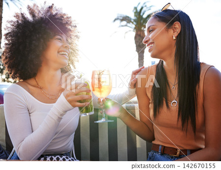 Girl friends, cheers and cocktail at bar with summer drink, alcohol and happy at a restaurant. Smile, bonding and women with toast to celebrate holiday and fun vacation in Miami with beverage Girl friends, cheers and cocktail at bar with summer drink, alcohol and happy at a restaurant. Smile, bonding and women with toast to celebrate holiday and fun vacation in Miami with beverage 142670155