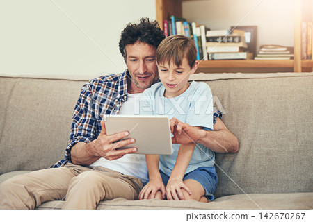 Sofa, tablet and father with child in home for watching movies, cartoons and online entertainment. Family, love and happy dad with son on digital tech for internet, video call and relax on weekend Sofa, tablet and father with child in home for watching movies, cartoons and online entertainment. Family, love and happy dad with son on digital tech for internet, video call and relax on weekend 142670267